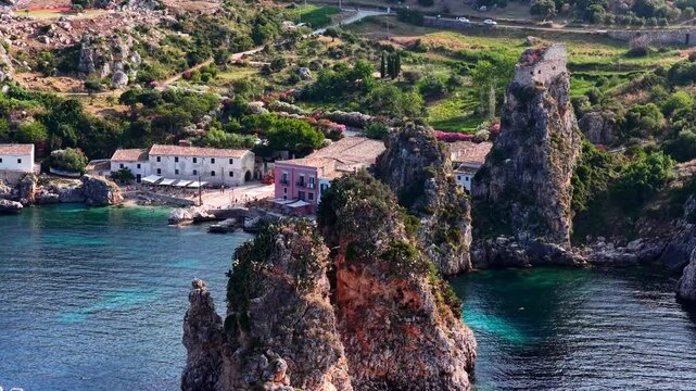 Il mare della Sicilia, Italia. Tonnara di Scopello. 4K
Vista aerea della costa pi&ugrave; bella della Sicilia. La baia di Scopello, tra Palermo e San Vito Lo Capo. Riserva dello Zingaro. 