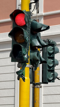 Melted Traffic Light in Extreme Summer Heat on Urban Street Pole
