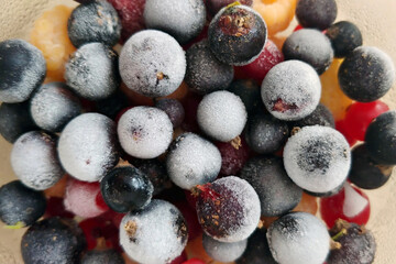 A fresh assortment of frosted summer berries for smoothies and desserts.