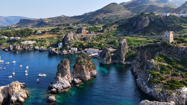 Il mare della Sicilia, Italia. Tonnara di Scopello. 4K
Vista aerea della costa pi&ugrave; bella della Sicilia. La baia di Scopello, tra Palermo e San Vito Lo Capo. Riserva dello Zingaro. 