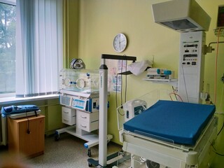 incubator for premature newborn and resuscitation table in the maternity hospital