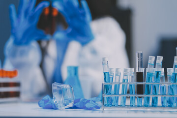 Research, experiment and medical trial being done by a scientist in a lab, science facility or hospital. One young, serious and professional researcher organizing, sorting or making a discovery