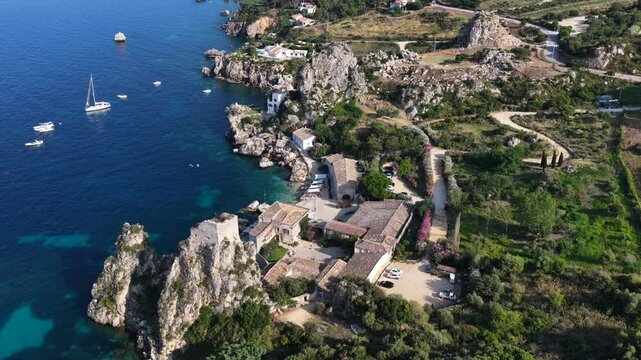 Il mare della Sicilia, Italia. Tonnara di Scopello. 4K
Vista aerea della costa pi&ugrave; bella della Sicilia. La baia di Scopello, tra Palermo e San Vito Lo Capo. Riserva dello Zingaro. 