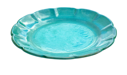 Empty teal ceramic plate with scalloped edge on white background
