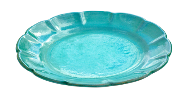 Empty teal ceramic plate with scalloped edge on white background