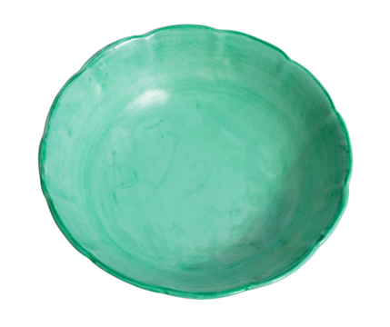 Empty green ceramic bowl with wavy edge on white background