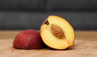 Nectarine fruit with stone in cross section, cut in half