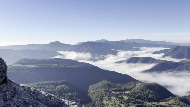 Fog rolling over the hills and mountains of Osona, Barcelona