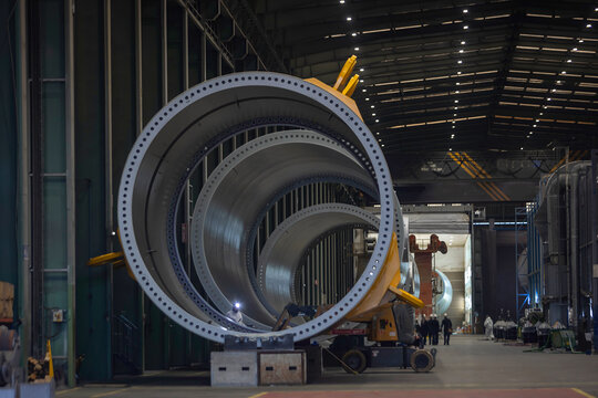 Wind Turbine Components in a Manufacturing Facility. Wind energy - Powered by Adobe