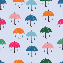 A delightful pattern featuring various colorful umbrellas against a soft blue background, complemented by small raindrops.
