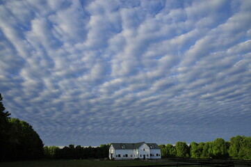  Beach sand clouds in the sky  clods over barn