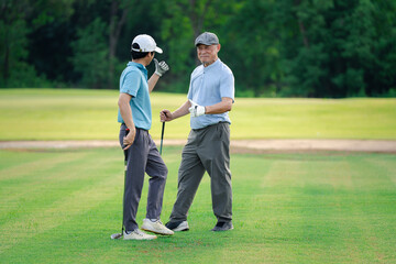 Obraz premium Good shot buddy. Shot of two happy men playing a game of golf. Golf, friends and sport with men on course playing