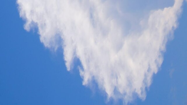 The top of the cloud with vertical development, cumulonimbus incus . Stretched clouds indicate a strong wind. There was a severe thunderstorm at night