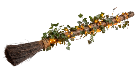Broomstick decor wrapped in ivy and orange lights Transparent background, PNG file