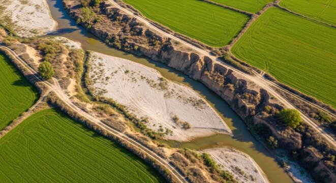 Aerial View of River and Farms Near Agricultural Land