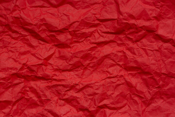 Fototapeta premium Close-up of red crumpled paper background texture,Red crumpled paper background or texture in detail
