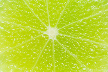 Close-up macro lemon texture,texture of lime fruit background close-up macro. Fruit in water under...