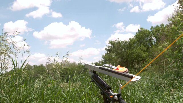 Shooting clay pigeon from launcher slow motion
