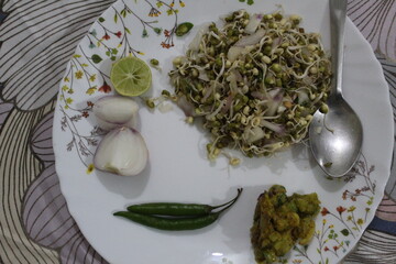 Fresh Mung Bean Sprouts with Lime and Spices on a Plate.