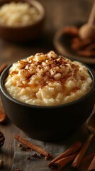Creamy rice pudding topped with a drizzle of syrup and sprinkled with cinnamon in a cozy kitchen setting