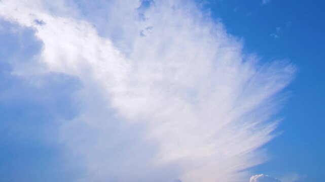 The top of the cloud with vertical development, cumulonimbus incus . Stretched clouds indicate a strong wind. There was a severe thunderstorm at night