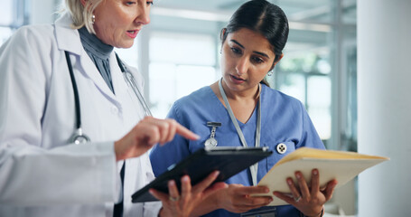 Doctor, mentor and tablet with people in hospital for discussion, healthcare report and teamwork....