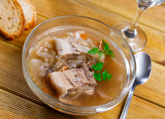 Appetizing Russian dish Shchi - sour cabbage soup served in bowl