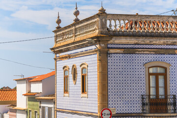 Ornate building facade covered in traditional azulejos tiles in Tavira