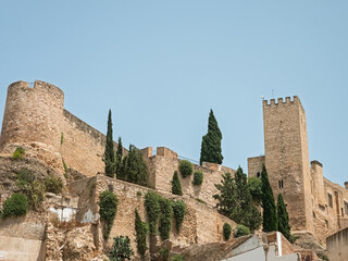 The imposing medieval castle of La Suda dominating the skyline of Tortosa, a historical landmark in Catalonia. Shot taken from public street.
