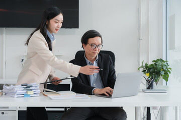 Business Colleagues Working Together at Desk