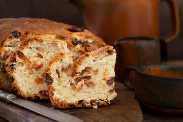 Traditional Irish Halloween Homemade fortune-telling Bairín Breac or Barmbrack Bread  or Tea Break with honey butter