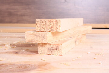Stack of Freshly Cut Wooden Planks with Wood Shavings