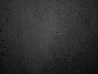 Dark textured surface with a rough, uneven appearance, featuring a variety of subtle shades and...