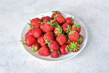 Close-up of a Plate Full of Fresh Ripe Strawberries