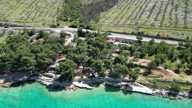Aerial view of the Croatian coast with small campsites in the bay of Greba&scaron;tica close to Primosten in Dalmatia