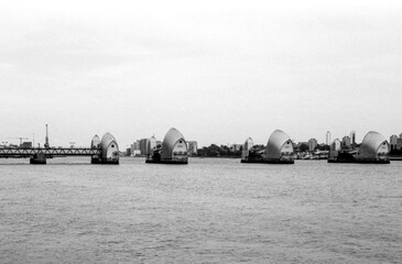 Thames barrier protecting london from flooding on a grainy vintage analog photo