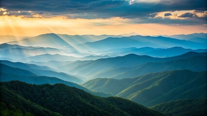Fototapeta premium Beautiful mountain range with sunlight rays and mist