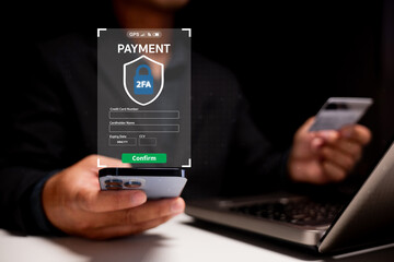A person uses a smartphone and credit card to complete a secure two-factor authentication payment...