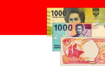 Fototapeta premium Various Indonesian Rupiah banknotes. Indonesian money. National flag of Indonesia.