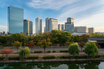 View of the park around Osaka Castle and the surrounding urban landscape on a sunny autumn day, Osaka, Japan