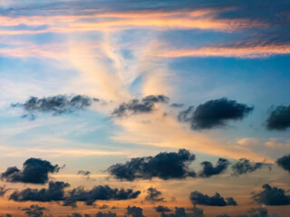 Foreground of ragged cloudlets in silhouette against background of brighter clouds, some in wind shear, at higher altitude. Digital oil-painting effect, 3D rendering. Contrasts in natural transition.