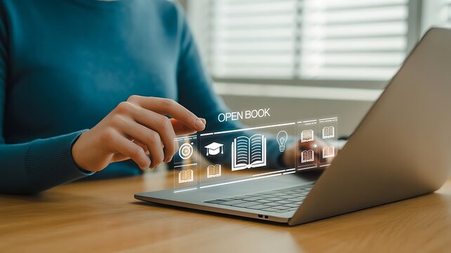 Person using laptop with open book and education icons overlayed on screen