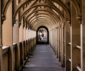 Diminishing perspective of covered walkway under Tyne Bridge in Newcastle upon Tyne, England, creating vanishing point