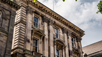 Architectural detail of the historic Post Office building in Newcastle upon Tyne, showcasing ornate stonework and large windows