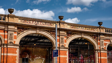 Ornate Victorian brickwork and signage above the departure entrance of Leicester Railway Station