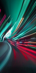 Abstract blurred motion effect with green and red light streaks on dark background.