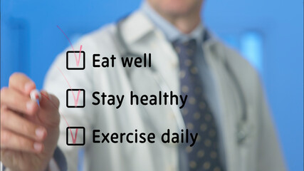 Doctor writing and checking healthy lifestyle recommendations on a transparent board, ticking the...