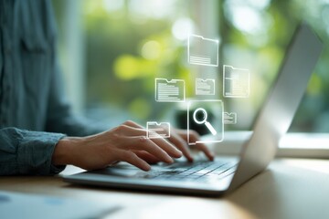 A person is typing on a laptop with a search bar on the screen