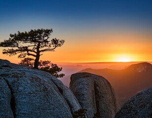 Breathtaking Sunset Over Mountain Range with Lone Tree Silhouette and Rocky Foreground, Scenic Landscape Photography