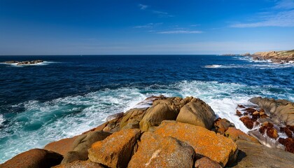 Stunning Coastal Landscape Rocky Shoreline, Blue Ocean, and Clear Skies in Beautiful Daylight - Scenic Photography